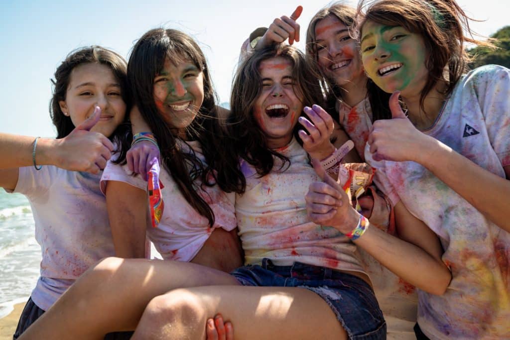 Smiling and Laughing Girls Covered in Chalk